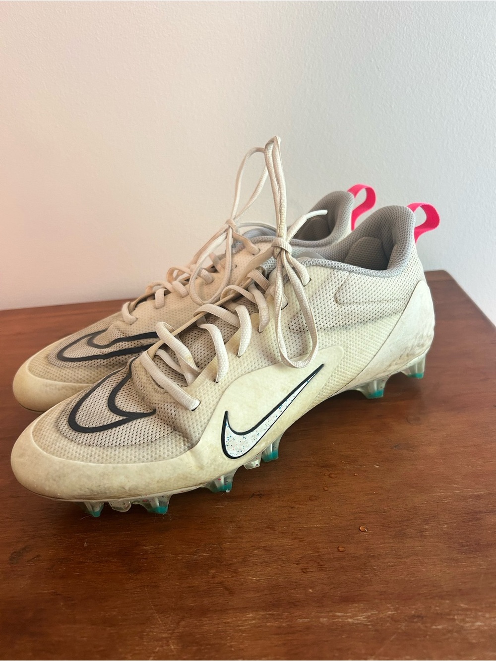 Nike Alpha Huarache 8 Pro lacrosse cleats in a sail and hyper pink